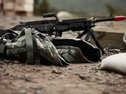 Ground level tracking shot of M240 machine guns. Stock Footage