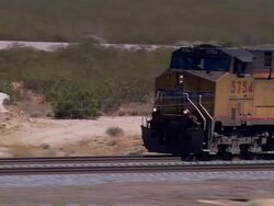 Aerial TS MS of freighter train. Mojave Desert, California, United States. Stock Footage