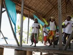 Static shot of girls dancing on stage as guy pay the bongo drums. Stock Footage