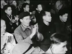 B/W 1950s high angle young Asian people in audience clapping / Communists / North Vietnam Stock Footage