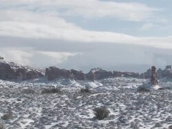 MS ZO View of Fresh Snow on Red Rock Desert, Natural Arch / Moab, Utah, United States Stock Footage