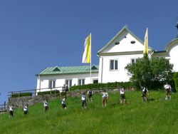 MS Mountain shooters at abbey Maria Eck near Siegsdorf, Chiemgauer Alps / Siegsdorf, Bavaria, Germany Stock Footage