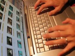 Close up of hands typing on computer keyboard Stock Footage