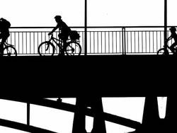 HD Cyclists Crossing a Bridge (B&W) Stock Footage