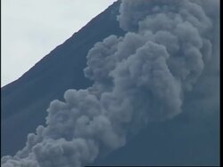Smoke billows out from volcano and spreads down mountain News Clip