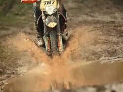 HD Super Slow-Mo: Motocross Racing In The Mud Stock Footage