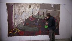 A painter works on a large mural. Stock Footage