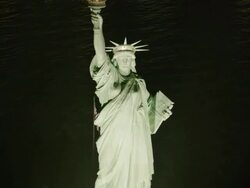 Aerial Approach over Statue of Liberty at night, NYC Stock Footage