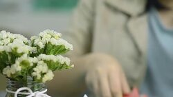 dolly and focus foreground: cut paper with scissors Stock Footage