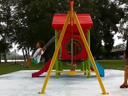 swinging on playground Stock Footage