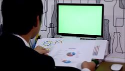 Businessman read financial report with green screen labtop Stock Footage