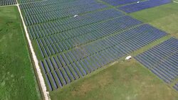 Slow Motion Aerial Drone Over Solar Power Plant Renewable energy from the Sun Stock Footage