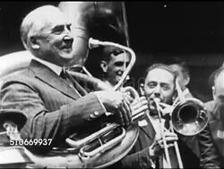 1920: SUMMER PRESIDENTIAL CAMPAIGN: Singer Al Jolson performing outside (No SOT), Senator Warren G. Harding (1865-1923) posing w/ band's tuba, MS Charles Evans Hughes, Sr. on porch next to Al Jolson. Actress Lillian Russell speaking from porch. Instructional Video