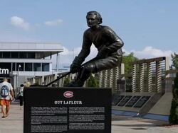 MS T/L Guy Lafleur statue in front of Bell Centre / MONTREAL, QUEBEC, Canada Stock Footage