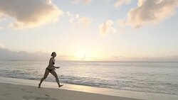 Ballet dancer jumping against sunset Stock Footage