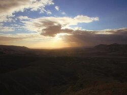 clouds over desert in sunrise time Stock Footage