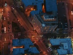 Aerial looking directly down a building and streets in Harlem at night, NYC Stock Footage