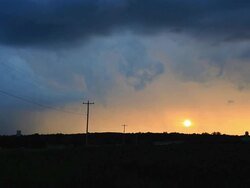 Time lapse of thunderstorm clouds during sunset Stock Footage