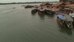 Boats dock along the Mekong River in China. Stock Footage