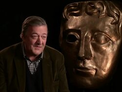 INTERVIEW - Stephen Fry on being at BAFTA for ten years,  splitting of TV and Film Awards, changing the date to before the Oscars atBAFTA interview Stock Footage