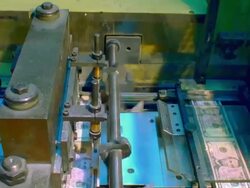 T/L, CU, Sheets of American five dollar bills on cutter, Washington DC, USA Stock Footage