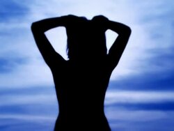 Woman silhouette at dusk Stock Footage