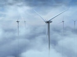 Dolly screen-left past windmills in the clouds Stock Footage