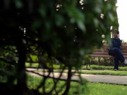 Dolly Shot:Girl talk by smart phone Stock Footage