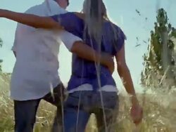 POV, MS, Following couple walking through high grass in meadow, rear view, Saint Ferme, Gironde, France Stock Footage
