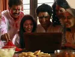 Family celebrating holi festival on the laptop Stock Footage