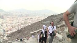 CLEAN : With sweat and tears pilgrims scale Meccas mountain of light News Clip
