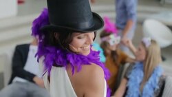 Woman dancing in top hat and feather boa Stock Footage