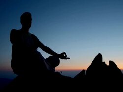 HD DOLLY: Silhouette Of A Man Meditating Stock Footage