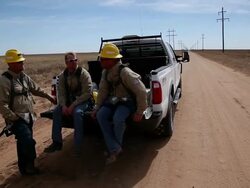 MS Three energy workers sitting on truck and talking / Hooker, OK, United States  Stock Footage