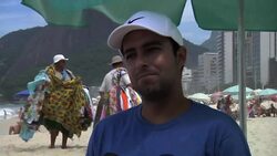 Group in Rio helping people out of wheelchairs and into the waves Instructional Video