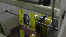CLOSE UP Goya food labeling machine in Goya Foods, Inc. facility Stock Footage