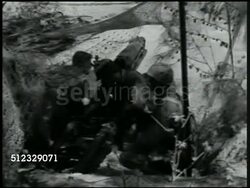 1942: U.S. MARINE CORPS ARTILLERY: Marines looking at map on table in forest. VS Soldiers manning, firing cannons behind net, camouflage, foliage. MS Marines unloading artillery shells from truck. CU Cannon firing, smoke. World War II, WWII Instructional Video
