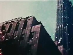 1962 low angle tilt down PAN from tops of buildings to ticker tape parade on NYC street / John Glenn Stock Footage