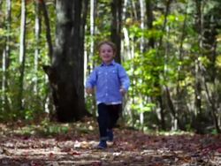 Cute boy running in the park Stock Footage