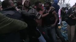 CLEAN : Africans protest Greek Macedonia border closure with song dance News Clip