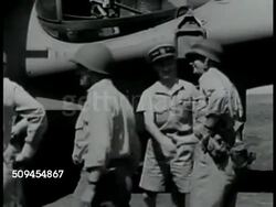 1942: U.S. MARINES: VICTORY: MS Soldiers, sailors & officers shaking hands. WS Men carrying cargo, crates from transport boat on beach. WS Topless soldiers waiting on line by load. WS Soldiers on line getting food, soup. Guadalcanal, WWII Instructional Video