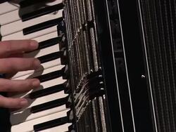 Medium Close Up static - An assembler tests the treble keyboard of an accordion /  Germany Stock Footage