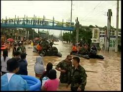 US forces help with flood rescue, 106 dead or missing, Arroyo News Clip