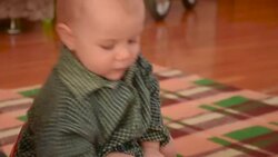baby sitting on a children's pot Stock Footage
