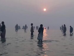WS TU People wading and praying in t waters of  Ganges river / Kanpur, Uttar Pradesh Stock Footage