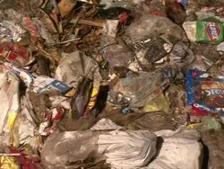 Close Up Pan Left - Filth covered trash / New Orleans Louisiana Stock Footage