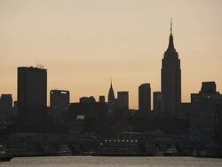 The city in silhouette early morning as the sun warms the horizon. Stock Footage