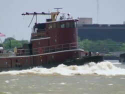 MS TS Tugboat cruising along in Mississippi river / New Orleans, Louisiana, United States Stock Footage