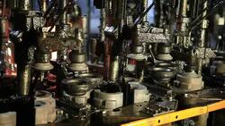 Glass factory. Close up of  hot liquid poured into shape. Stock Footage