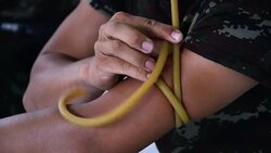 Man arm with a tourniquet Stock Footage